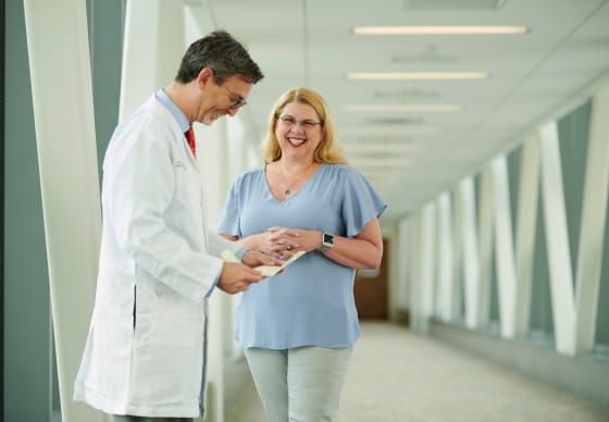 Dr. Ron Landmann, MD, talking with Candice “Candy” Porter.