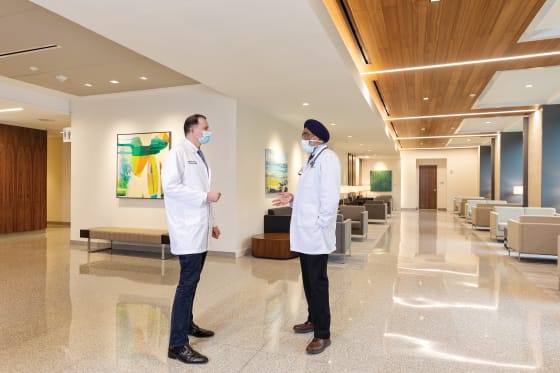 multi-disciplinary pair of physicians meeting