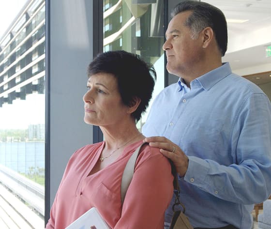 A patient and her husband look out the Baptist MD Anderson Cancer Center window to the St. John's River.