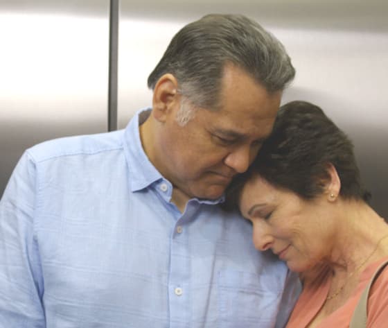 A female patient leans against her husband in the elevator on her way to her first Baptist MD Anderson appointment.