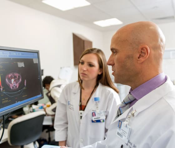 Dr. Gorak, hematologist oncologist, reviews scans with health care professional.