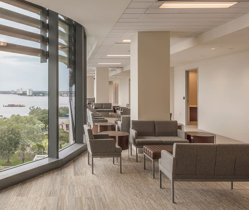 A serene upper-level waiting area, the the St. John's River seen through the big windows.