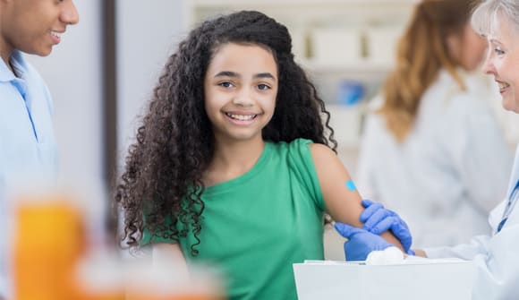 young girl getting a shot