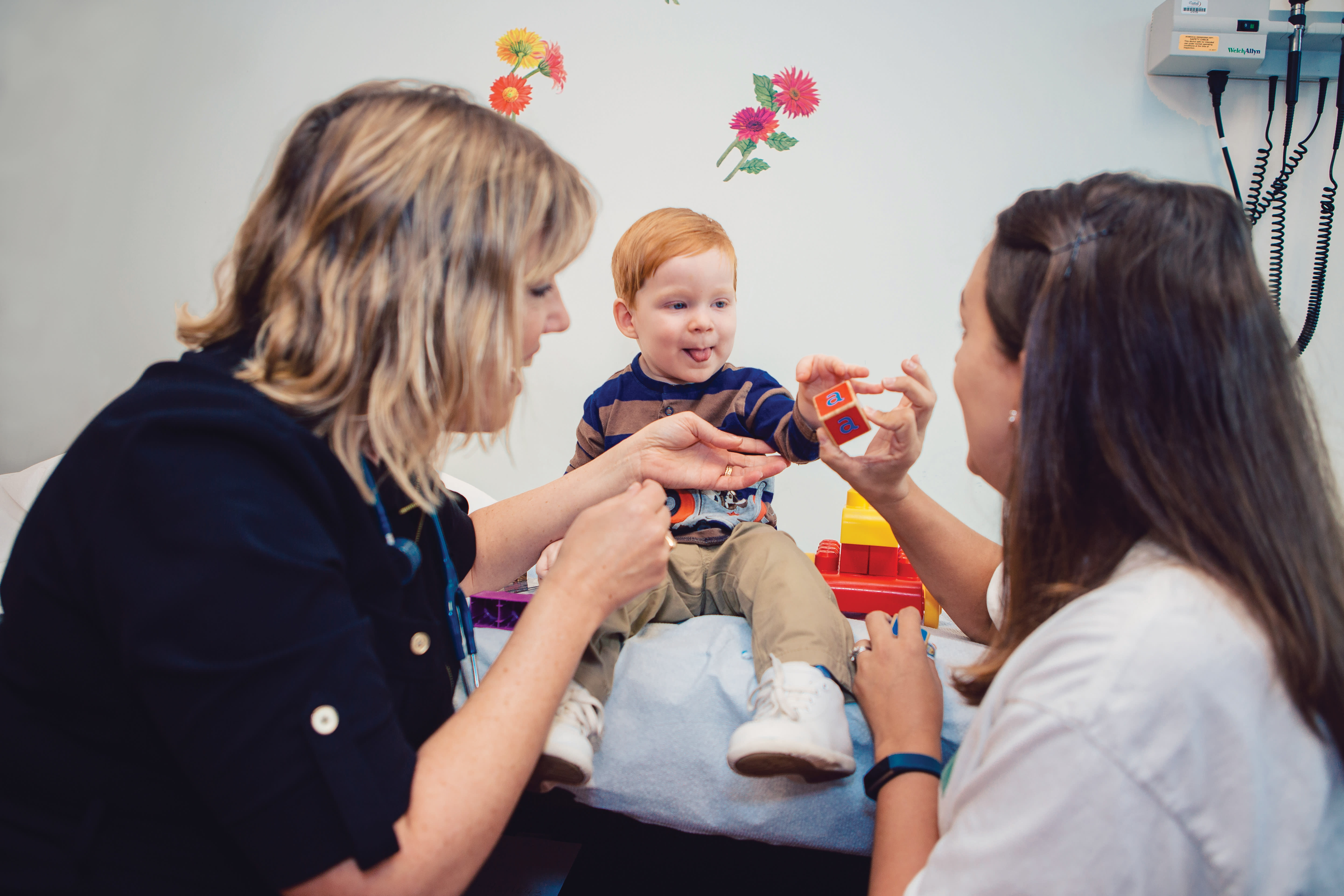 Pediatric brain spasticity patient with provider and parent