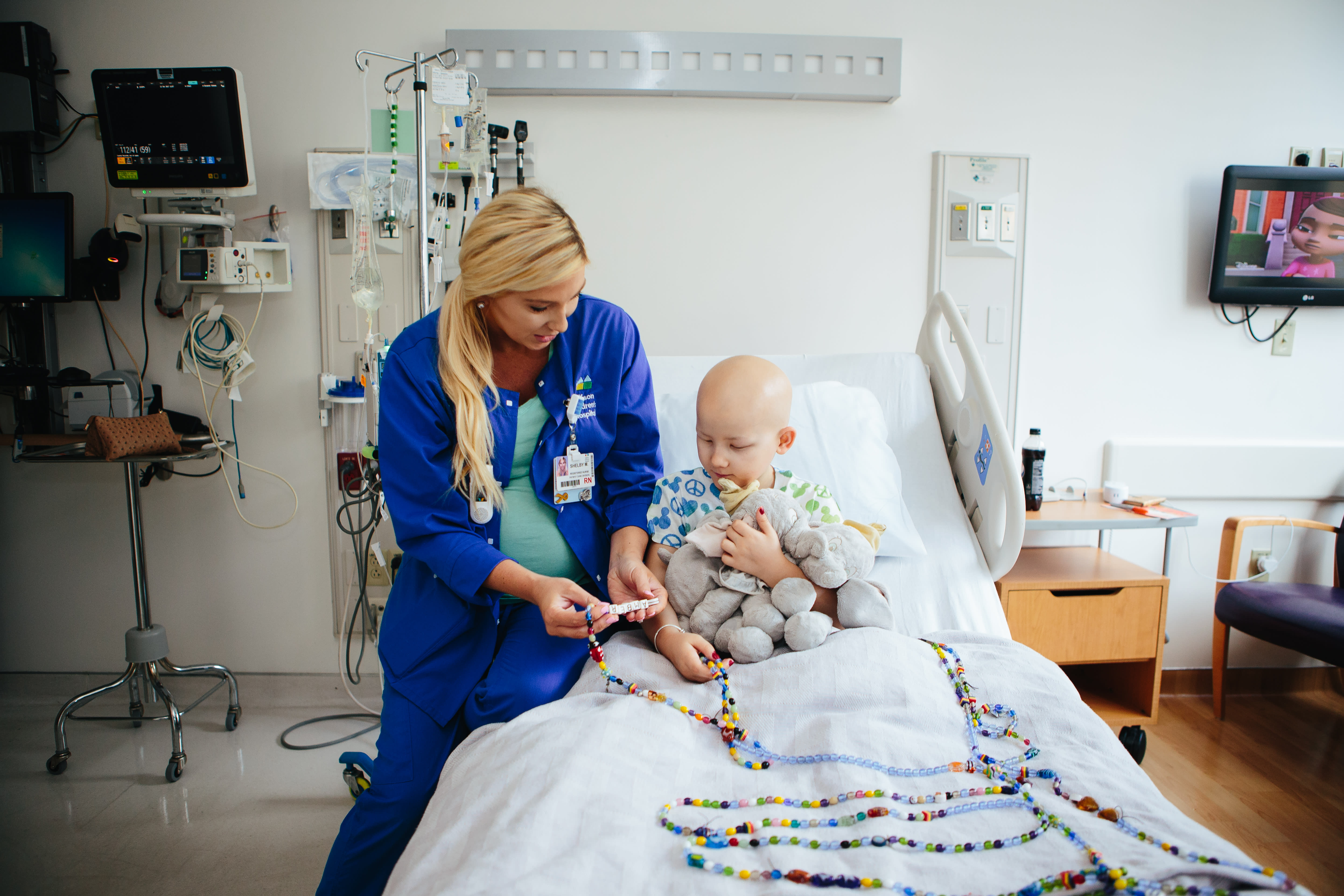 Pediatric cancer patient with nurse