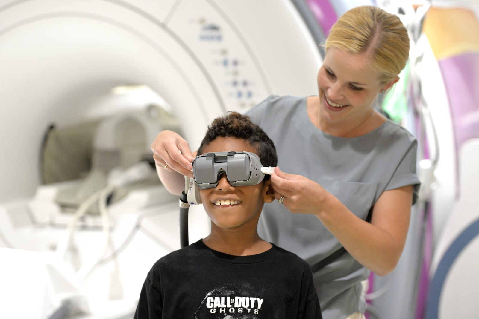 pediatric radiologic technologists and pediatric patient with MRI googles