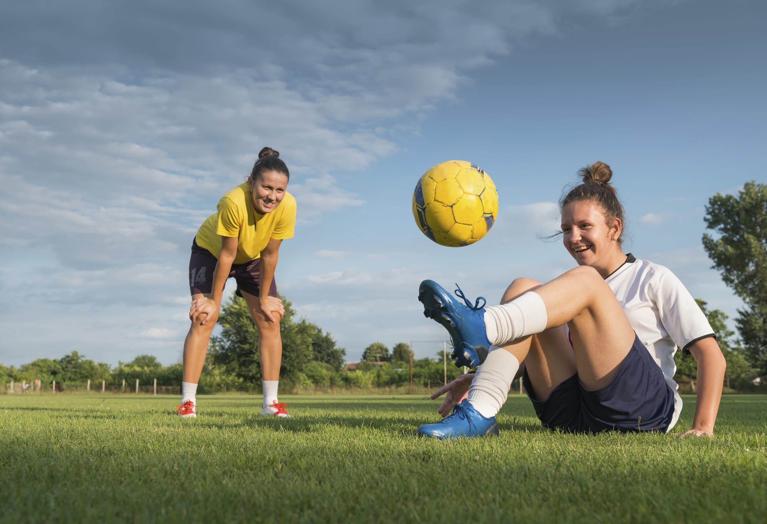 youth girls playing soccer