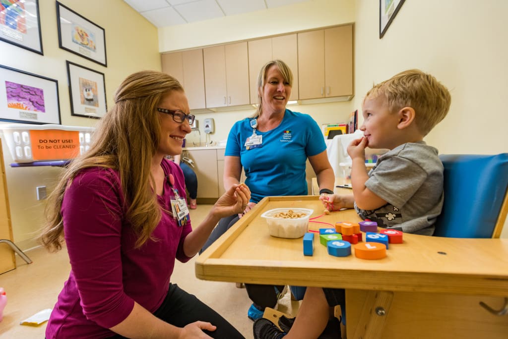 Speech-language pathologist working with a pediatric patient