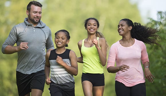 diverse family gets in the cardio zone while jogging together