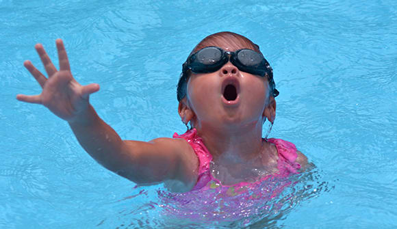 Child in pool gasping for air.