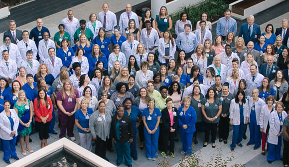 People standing in hospital courtyard