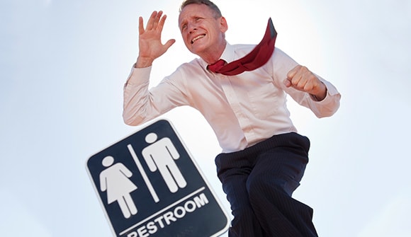 man running to the bathroom