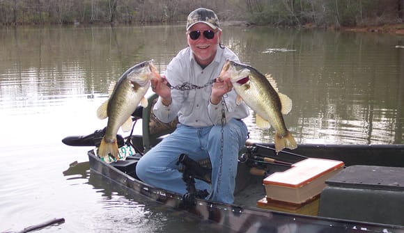 man holding up fish