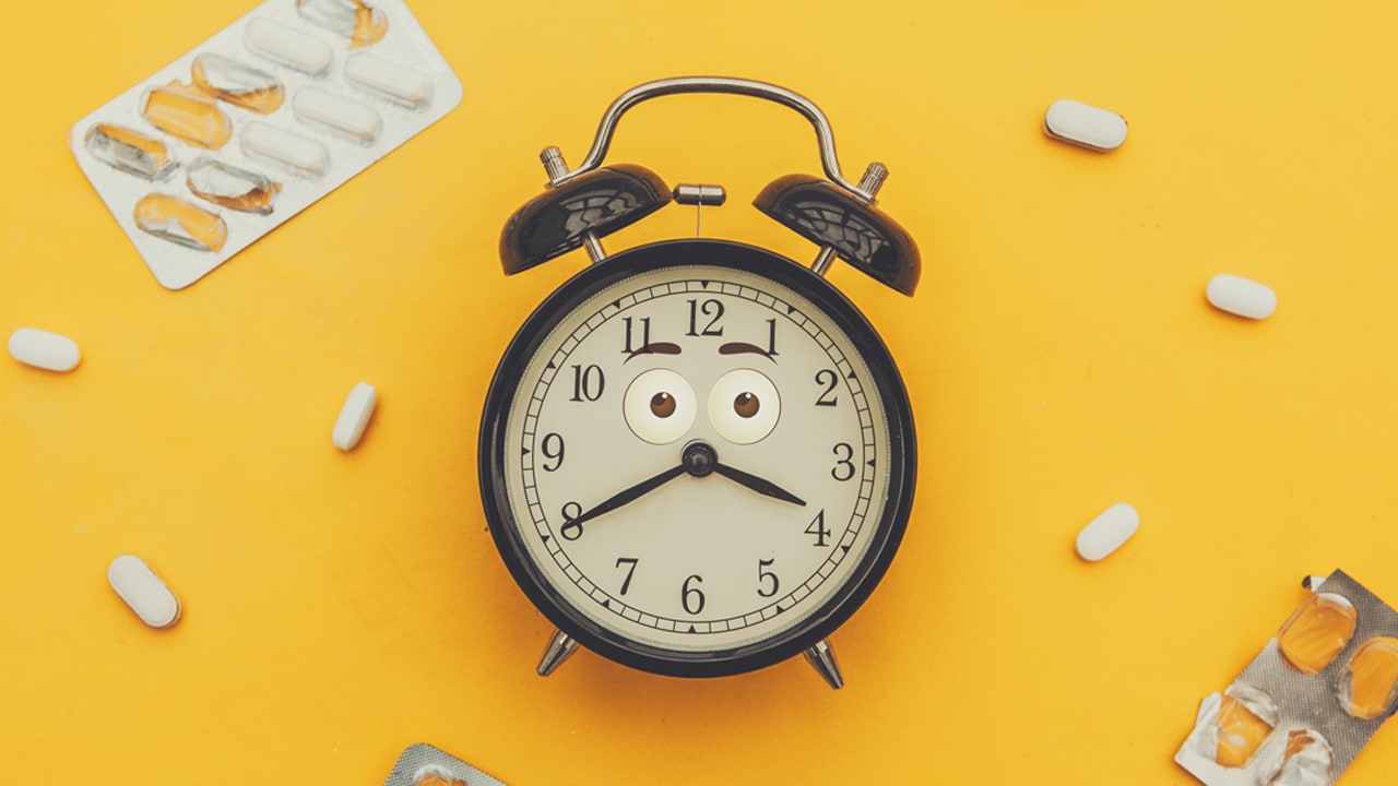 alarm clock and assorted pills