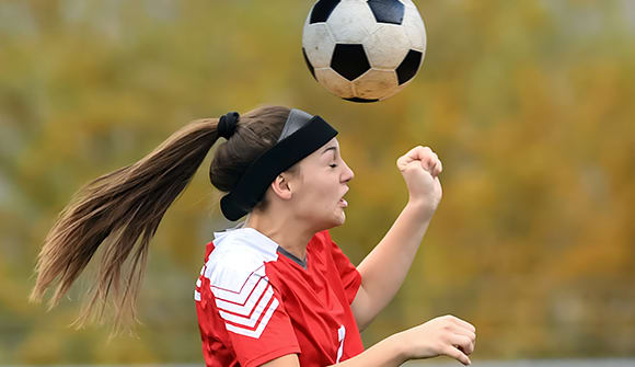 woman playing soccer