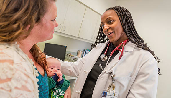 Dr. Shawyntee Mayo with a patient