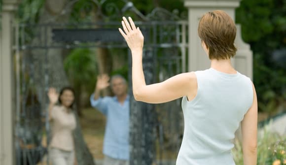 Neighbors waving from a distance