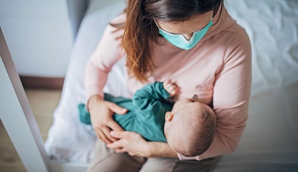 breastfeeding mother with baby