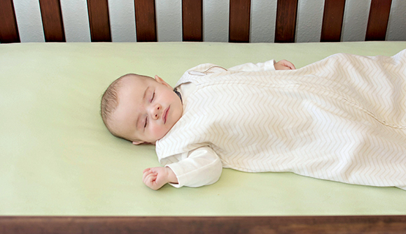 Safe sleeping position on back for infant