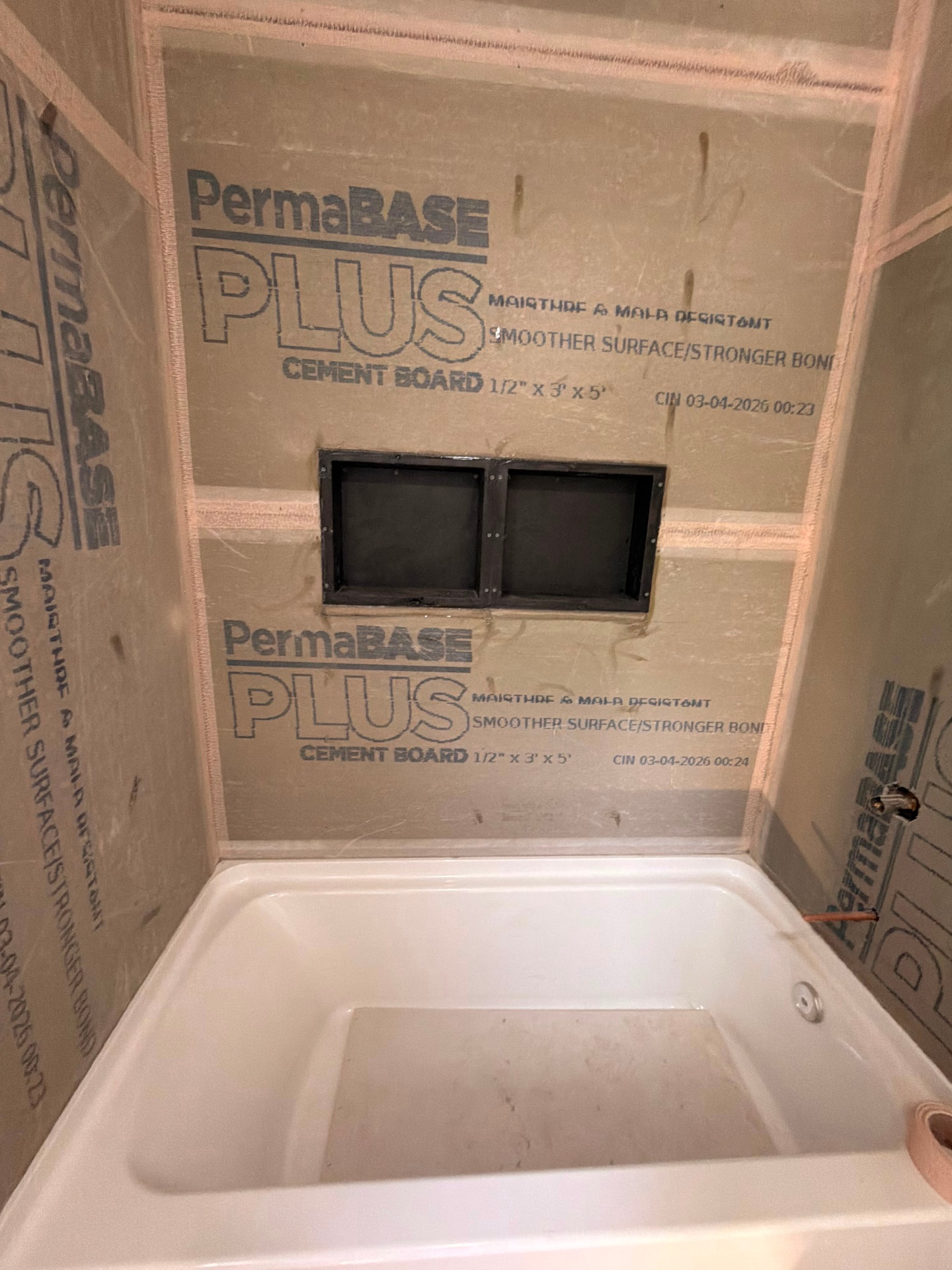 Bathroom tub surround framed with PermaBase cement board before tile installation