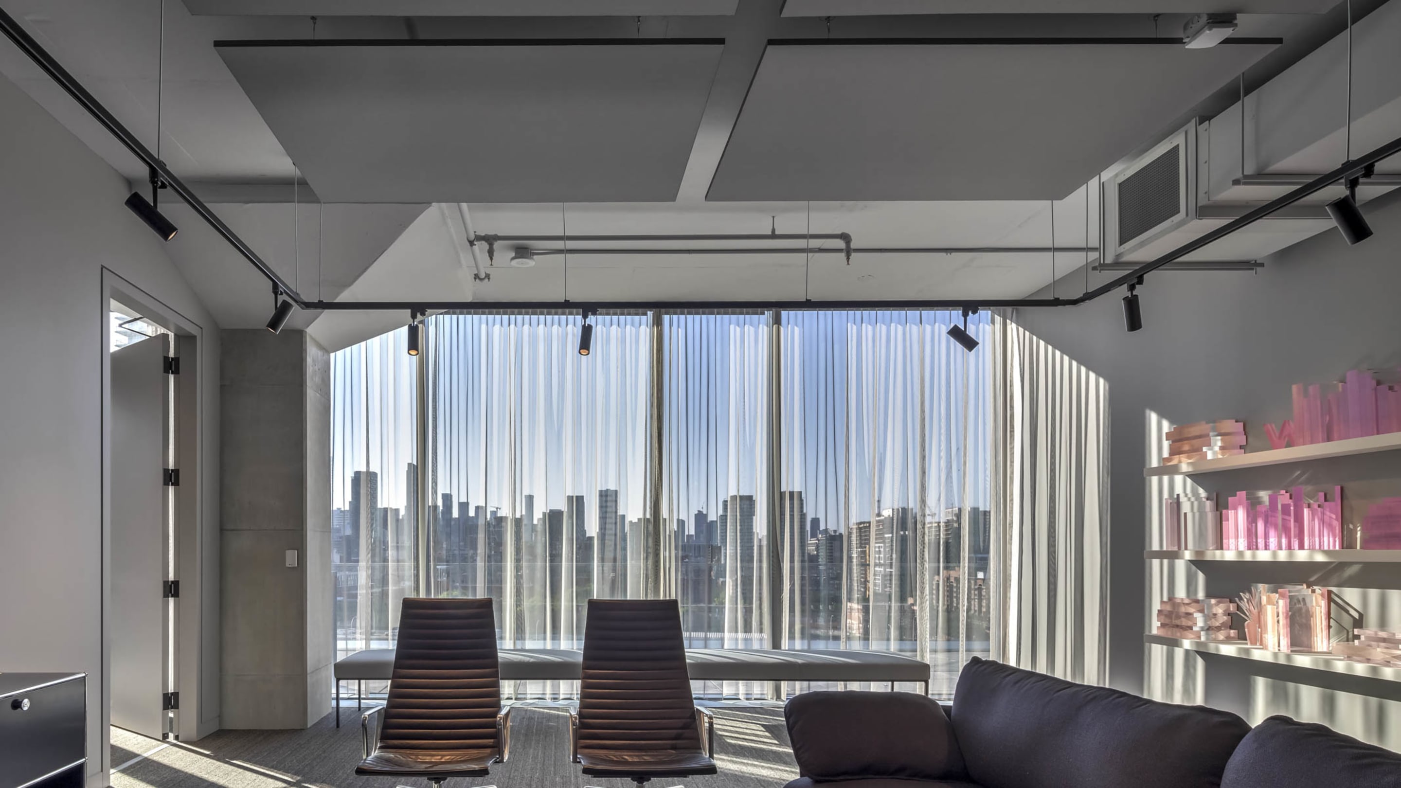 corporate meeting room with acoustic ceiling tiles curtains chairs