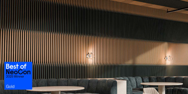 Wall to ceiling installation of Zintra Baffle Systems Ying Yang featuring mirrored, interconnected curves in contrasting tones, creating a striking visual and sound-absorbing statement