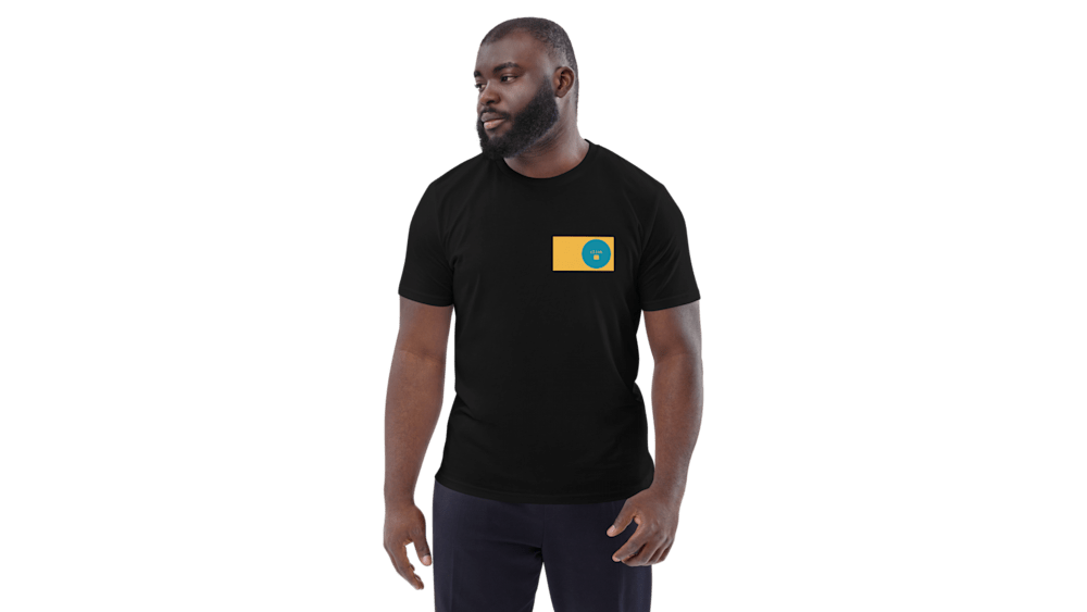 A closeup of a man wearing a black shirt with a yellow and blue circle on it.
