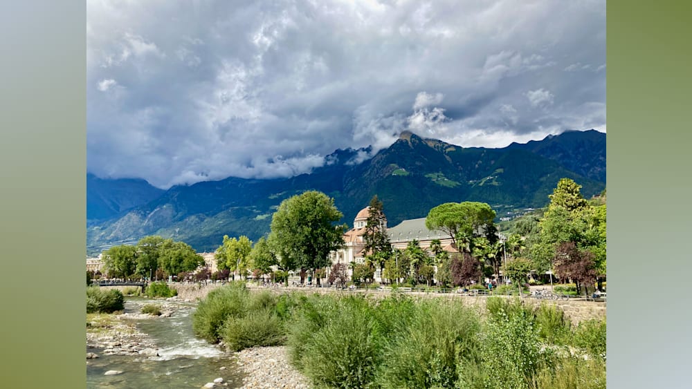 A church with a mountain in the background.