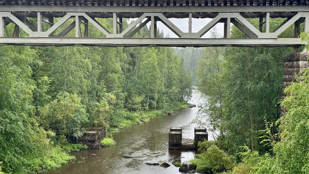 A bridge over a river with a platform in it.
