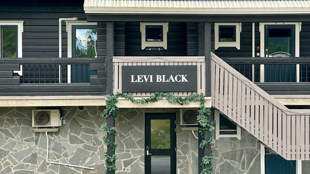 A sign that says Levi Black on it outside a house.