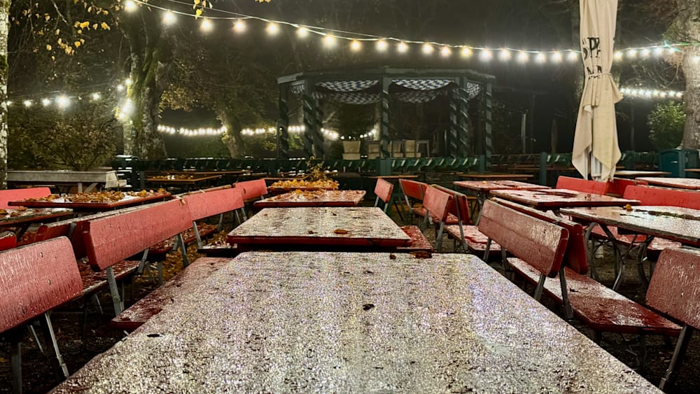 The outdoor dining area is empty with only a few chairs and tables set up.