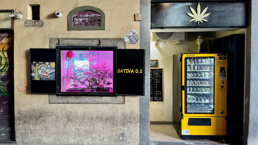 A yellow vending machine with the number 0 on it.