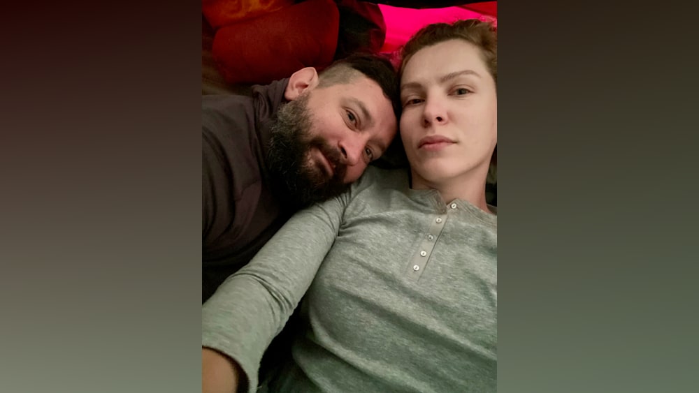 A man and a woman lying next to each other.