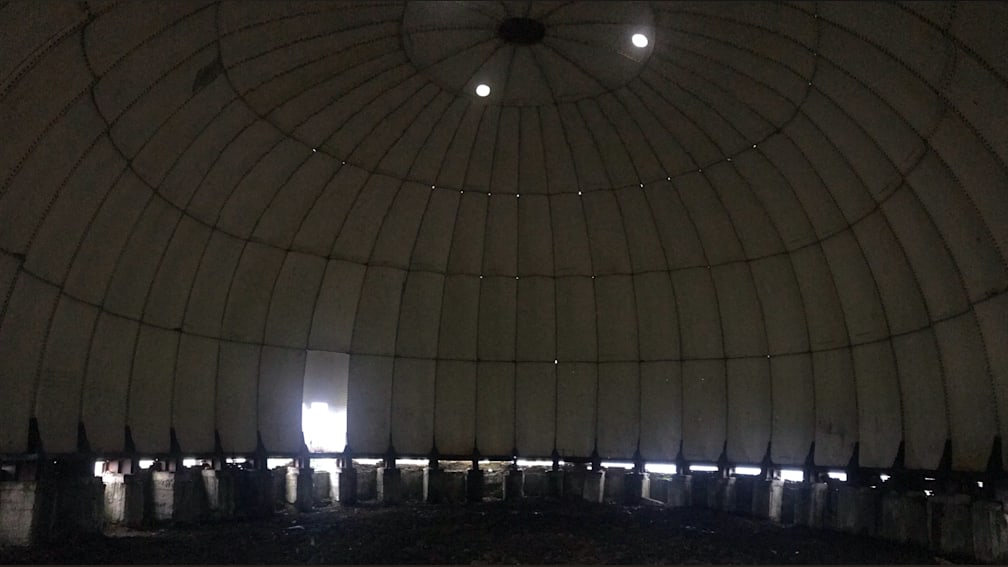 A large, empty room with only a few items in it.