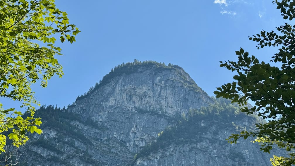 A rock face is shown with red dots all over it, below it.