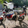 A white and red motorcycle with the word Africa Twin on it.