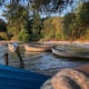 Three boats are in the water and they are blue in color.