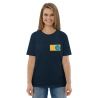 A woman wearing a navy blue shirt with a yellow and blue circle on the front.
