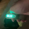 a person holding a digital scale with 949 on the screen.