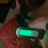 A person is holding a digital scale with their left hand and the number 728 is displayed.