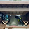A tent sits on top of a table inside of a building.