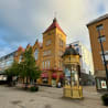 A street with a tall building and a yellow box saying "Prairie Dog.".