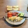 A plate of food with a fork and knife on a table.