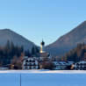 A church with a mountain in the background.