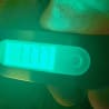 A digital watch with the time displayed of 11:57.