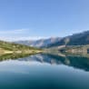 A large lake with a mountain in the background.