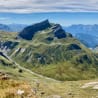 A mountain with a valley between the two peaks.