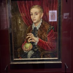 Boy With Apple - a painting of a boy holding an apple