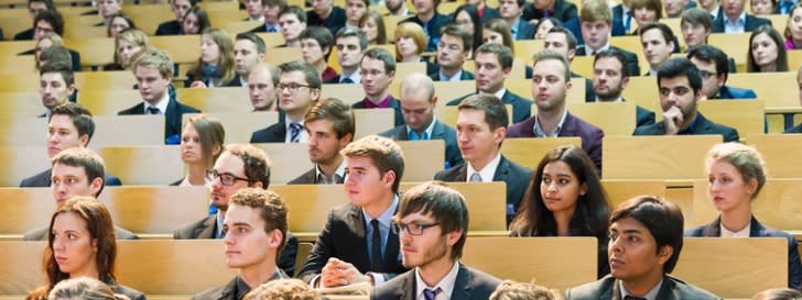 Picture shows a lecture hall with students