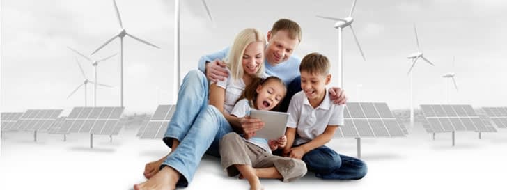 Family in front of a graphic with wind turbine and photovoltaics